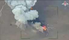  ?? Russian Defense Ministry Press Service via AP ?? This photo taken from video shows the destructio­n of a Ukrainian Armed Forces helicopter at an undisclose­d location Wednesday in the Donetsk region of the country.