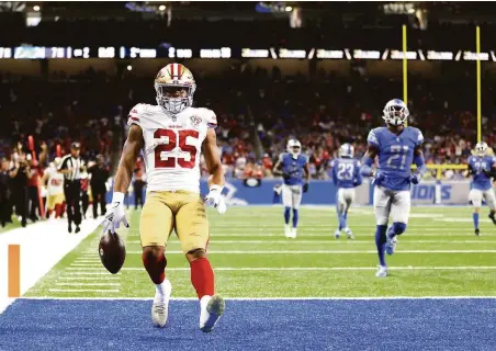 ?? Gregory Shamus / Getty Images ?? Elijah Mitchell arrives in the end zone after his 38-yard run in the second quarter, giving the 49ers a 14-7 lead over the Lions.