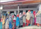  ?? WASEEM ANDRABI/HT ?? Residents waiting in long queues to cast their vote during the second phase of District Developmen­t Council elections in Kangar area of Ganderbal on Tuesday.