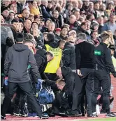  ??  ?? BAD BLOOD Lennon is floored in Edinburgh derby