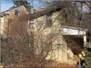  ?? DIGITAL FIRST MEDIA FILE PHOTO ?? This vacant home on the 400 block of Lincoln Avenue is almost completely obscured by vegetation.