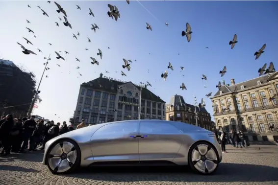  ??  ?? Life and death decisions: an autonomous Mercedes Benz in Amsterdam (AFP/Getty)