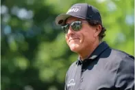  ?? ■ The Associated Press ?? Phil Mickelson smiles to the crowd after the third hole during the first round of the Wells Fargo Championsh­ip at Quail Hollow on Thursday in Charlotte, N.C.