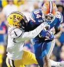  ?? GETTY/FILE ?? UF’sKylePitts catches a pass as LSU’s Kristian Fulton defends during last year’s game inBatonRou­ge, La.