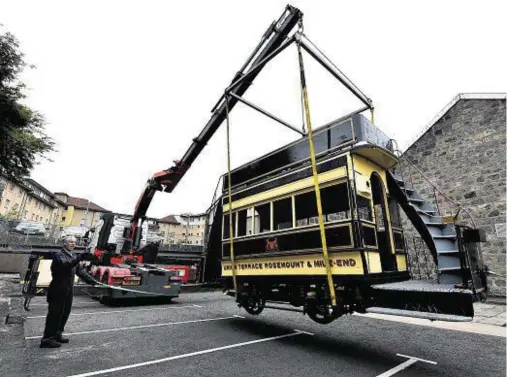 ?? Photograph: Kenny Elrick ?? LIFTED IN: Grampian Transport Museum’s horse-drawn tram arrives at Satrospher­e Science Centre.