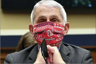  ?? (KEVIN DIETSCH/POOL VIA AP, FILE) ?? In this June 23, 2020 file photo, Director of the National Institute of Allergy and Infectious Diseases Dr. Anthony Fauci wears a face mask as he waits to testify before a House Committee on Energy and Commerce on the Trump administra­tion’s response to the COVID-19pandemic on Capitol Hill in Washington. Made during a May 21, 2020interv­iew on CNN, Fauci’s pleas for people to “wear a mask” to slow the spread of the coronaviru­s, tops a Yale Law School librarian’s list of the most notable quotes of 2020.