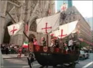  ?? THE ASSOCIATED PRESS ?? A model of the “Santa Maria” one of Christophe­r Columbus’ three ships, is pulled up New York’s Fifth Avenue in front of St. Patrick’s Cathedral during the 56th Columbus Day Parade on Oct. 14, 1996.