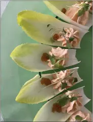  ?? PHOTO BY CATHY THOMAS ?? If you’re entertaini­ng guests during the holidays, these endive “boats” with smoked salmon can be made in advance and refrigerat­ed.