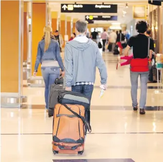  ?? TIMES COLONIST ?? Travellers make their way through Victoria Internatio­nal Airport, which welcomed 1,856,421 passengers in 2016, an increase of 8.5 per cent over numbers in 2015.