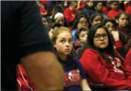  ?? MARTHA IRVINE — THE ASSOCIATED PRESS ?? Students listen to a presentati­on given by Rich Wistocki, a retired cybercrime detective, at Nathan Hale Elementary School in Chicago on Friday. Among other things, he gives them advice on how to stay safe on social media. Many kids at the K-8 school said they have social media and a good number said their parents either don’t know that or don’t know what they do with the accounts.