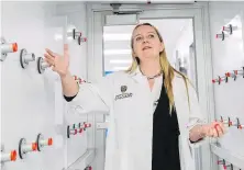  ??  ?? Kathy McCoy, director of the Western Canadian Microbiome Centre, stands in a sterilizat­ion chamber.