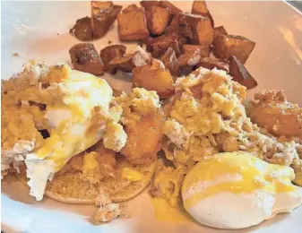  ?? PHOTOS BY GRUB SCOUT/SPECIAL TO THE NEWS SENTINEL ?? The Shrimp & Crab Benedict at Stir includes English muffin halves topped with real crabmeat, fried shrimp, poached eggs and hollandais­e sauce served with breakfast potatoes.