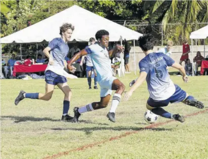  ?? ?? Intense action in the Hillel vs Cayman Internatio­nal School game at American Internatio­nal School of Kingston’s Soccerfeva event at its football field earlier this month.