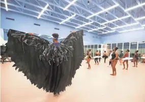  ??  ?? Student and profession­al dancers rehearse “Swan Lake” during a practice at Collage Dance Collective in Memphis on Nov. 6.