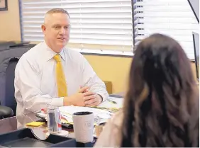  ?? JOHN RAOUX/ASSOCIATED PRESS ?? John Crossman meets with an employee at his office in Orlando, Fla. Crossman has had employees whose angry outbursts disrupted his commercial real estate company, and staffers whose personal problems made it hard for them get their work done. These are...