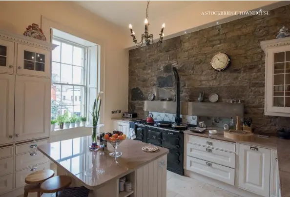  ??  ?? Above: The original stone wall was an unexpected find in the kitchen. Bottom right:The downstairs WC is a new addition.