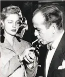  ?? Associated Press 1951 ?? Bogey and Bacall. Smoking rates are better in real life now but ridiculous onscreen.