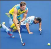  ?? AP ?? India's AffanYousu­f tumbles as Aussie Trent Mitton takes control.