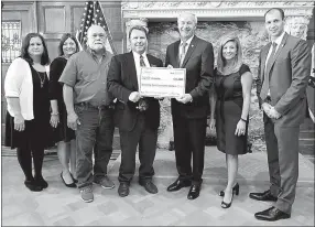  ?? Submitted Photo ?? Present at the grant award to Gravette were AEDC grants manager Brenda Rowell, Cassie Elliott of Visionary Milestones, Tim Dewitt, Mayor Kurt Maddox, Gov. Asa Hutchinson, AEDC executive vice president of operations Amy Fecher, AEDC executive director...