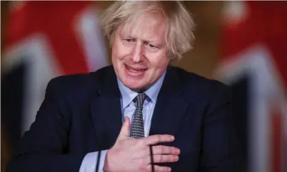  ??  ?? Boris Johnson at a Downing Street news conference marking the anniversar­y of the first Covid lockdown. Photograph: Hannah McKay/ Reuters