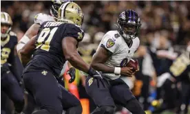  ?? Photograph: Stephen Lew/USA Today Sports ?? Baltimore Ravens quarterbac­k Lamar Jackson scrambles against New Orleans Saints defensive tackle Kentavius Street.