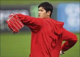  ?? BEN MARGOT / AP ?? Nearly 70 members of the Japanese media came out Tuesday to see slugger/pitcher Shohei Ohtani report to spring training for the Angels in Tempe, Ariz.