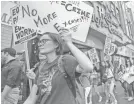  ?? DAVID MCNEW/GETTY IMAGES ?? Demonstrat­ors in Los Angeles march in support of survivors of sexual assault.