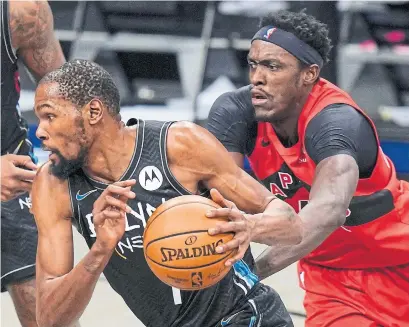  ?? FRANK FRANKLIN II THE ASSOCIATED PRESS ?? Kevin Durant, originally scratched, drives past Raptor Pascal Siakam in Friday night’s game. Durant played 19 minutes.