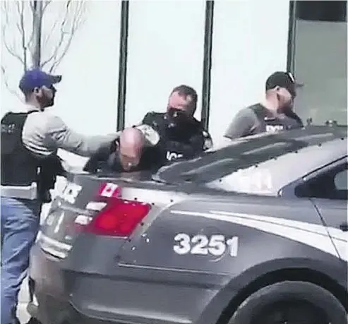  ?? TWITTER ?? A video posted on Twitter shows the arrest of the alleged driver of a van who struck dozens of pedestrian­s on Yonge Street in Toronto Monday afternoon. Ten people died and 15 others were injured in the attack.