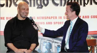  ??  ?? Former Republic of Ireland star Paul McGrath chats to MC Austin O’Callaghan at the sports awards.