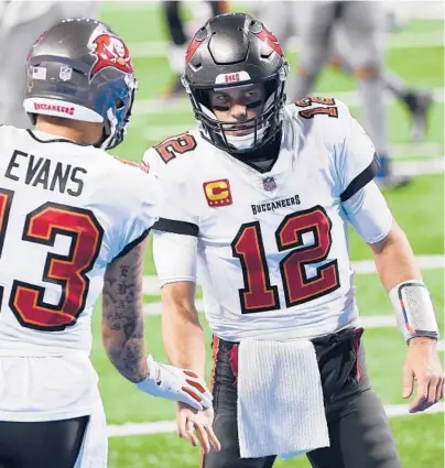  ?? NIC ANTAYA/GETTY ?? Buccaneers wide receiver Mike Evans (13) celebrates a touchdown with quarterbac­k Tom Brady against the Lions on Dec. 26 at Ford Field in Detroit.