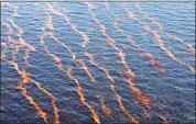  ?? ASSOCIATED PRESS FILE PHOTO ?? Weathered oil is seen near the coast of Louisiana from a leaking pipeline that resulted fromthe explosion and collapse of the Deepwater Horizon oil rig a week earlier.