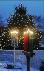  ??  ?? Montgomery County celebrates the holidays by lighting a Christmas tree, a menorah and a kinara in Norristown on Dec. 5.