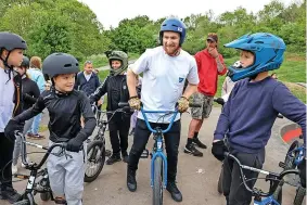 ?? ?? Above, Olympic freestyle BMX bronze medalist Declan Brooks meets young riders at the cycling facility in Stockwood; Below, the new track; Top and inset below left, Declan demonstrat­es his skills