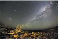  ?? ?? A long-exposure image taken with a fisheye lens shows the Milky Way above the Hakskeen Pan in the Northern Cape on 25 September 2014. Image: Nic Bothma/epa