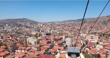  ??  ?? Past and present ... clockwise, from top, cable car to the mountains; Mostar city’s iconic Old Bridge; traditiona­l Bosnian coffee; disused bobsled track.