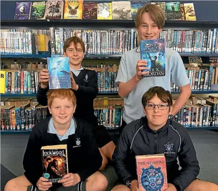  ?? TIM O’CONNELL/ STUFF ?? Nelson College Preparator­y School students Josef Fierek, Alex Bryant, Joshua Hobden and Jeremy Beetson aren’t reading too much into the hype as they prepare for the Kids’ Lit Quiz national final this weekend.