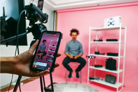  ?? AFP ?? Lalo Lopez from Spain practising with a drone at a studio in Shanghai where he usually live-streams to offer products on an Aliexpress channel in Spain.