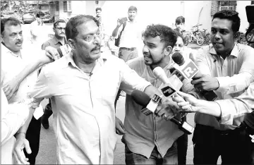  ?? — AFP photos ?? Actor Nana Patekar is mobbed on Oct 8 by the media as he leaves after making a statement outside his home in Mumbai. He is accused of having sexually harassed Dutta.