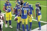  ?? KATELYN MULCAHY / Getty Images ?? The Rams’ Josh Reynolds, center, celebrates with teammates after catching a touchdown pass during Monday’s game against the Bears at Sofi Stadium in Inglewood, Calif.