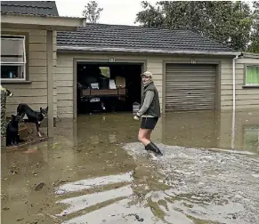  ?? PHOTO: IAIN MCGREGOR/STUFF ?? Paula Dobbs swam for her life at her property on Snodgrass Rd North of Westport while rescuing livestock and dogs during ex-Cyclone Fehi.