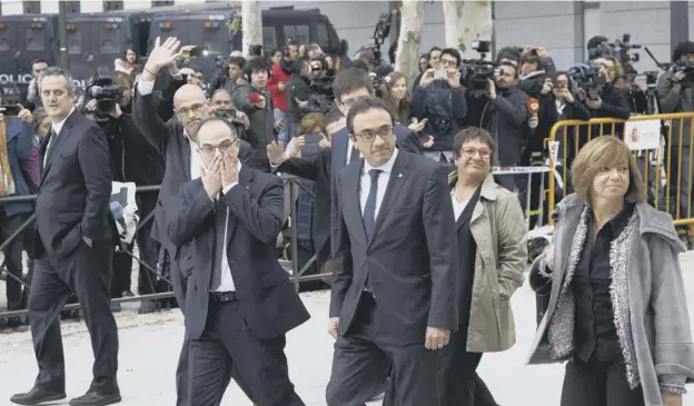  ?? PICTURE: GETTY IMAGES ?? 0 Former members of the Catalan government arrive at Spain’s National High Court in Madrid where eight were jailed