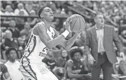  ??  ?? Florida State guard Devin Vassell lines up his 3-point shot on March 7.