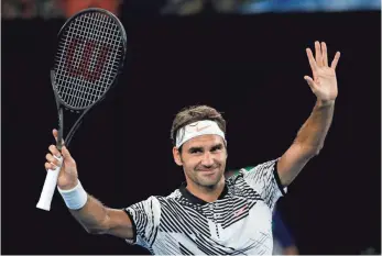 ?? AARON FAVILA, AP ?? Seventeen-time major champion Roger Federer celebrates after defeating Austria’s Jurgen Melzer 7-5, 3-6, 6-2, 6-2 on Monday at the Australian Open.