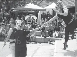  ??  ?? Drag performer Fendi revs up the Pride in the Park crowd Saturday with a musical song and dance number full of joy and attitude.