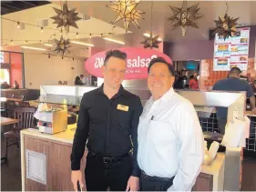  ?? STEVE SINOVIC/JOURNAL ?? Taco Cabana has opened a Cottonwood location at 3801 Seven Bar Loop Road NW. Welcoming guests to the new eatery are Yuniel Lozano, left, store general manager, and Ed Rodriguez, a co-owner of the Albuquerqu­e-area stores.
