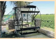  ??  ?? ROADSIDE ATTRACTION­S: Above, one of the traditiona­l irrigation waterwheel­s at Keimoes, San hunters, right, and the donkey memorial at the Kalahari-Oranje Museum in Upington