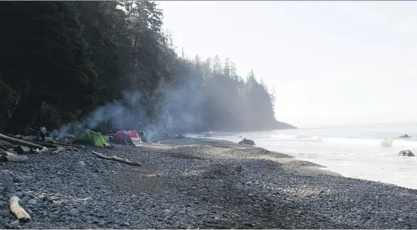  ??  ?? The half-mile stretch of Mystic Beach was filled with campers just before dark, but a warm welcome from a trio of women dispersed any sense of being interloper­s on the scene.