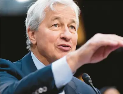  ?? SAUL LOEB/GETTY-AFP ?? JPMorgan Chase Chairman Jamie Dimon, seen Dec. 6, has called AI a revolution­ary technology that will upend jobs.