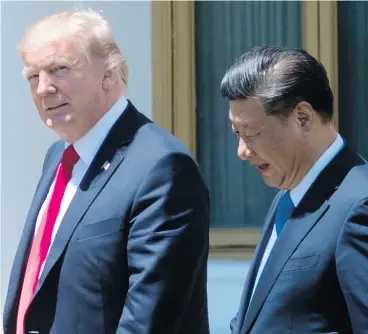  ?? JIM WATSON / AFP / GETTY IMAGES ?? U. S. President Donald Trump and Chinese President Xi Jinping at Mar-a-Lago in West Palm Beach, Florida on Friday.